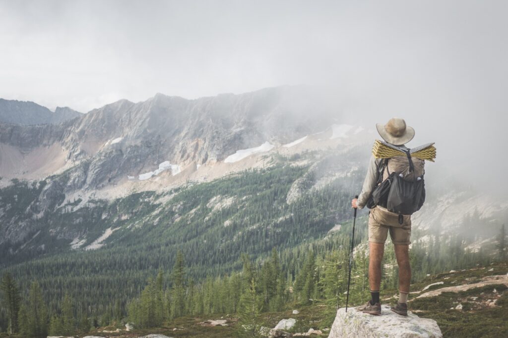 Me on the final day of my 100-day PCT thruhike, which I completed faster than the average hiker, but much slower than those setting FKTs. On the 2653-mile PCT, a 100-day thruhike meant that I averaged 26 miles per day, or a marathon per day.